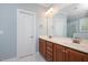 Elegant bathroom features a double vanity with modern fixtures, bright lighting and great space at 120 Tanager Farms Dr, Youngsville, NC 27596