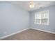 Cozy bedroom features plush carpet, a ceiling fan, and a bright window at 120 Tanager Farms Dr, Youngsville, NC 27596
