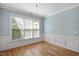 Dining area with classic wainscoting and a pendant light fixture at 120 Tanager Farms Dr, Youngsville, NC 27596