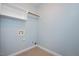 A well-lit laundry room includes a shelf and fixtures for a washer and dryer at 120 Tanager Farms Dr, Youngsville, NC 27596
