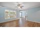 Spacious living room features wood floors and large windows that provide ample natural light at 120 Tanager Farms Dr, Youngsville, NC 27596