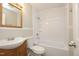 Bathroom featuring a vanity, toilet, and shower-tub combination with a new shower head at 1209 Landon St, Durham, NC 27703