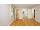 Bedroom featuring gleaming hardwood floors and access to a bathroom and closet at 1209 Landon St, Durham, NC 27703