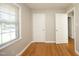 Bedroom offering hardwood floors, neutral colors, natural light, and closet storage at 1209 Landon St, Durham, NC 27703
