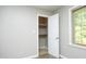 Walk-in closet with shelving and ample storage space, complemented by a window at 1209 Landon St, Durham, NC 27703