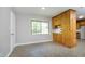 Bright dining area with knotty pine cabinets and large window allowing plenty of natural light at 1209 Landon St, Durham, NC 27703