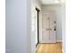Light-filled foyer featuring hardwood floors and a classic front door at 1209 Landon St, Durham, NC 27703