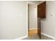 Hallway with hardwood floors and an open door at 1209 Landon St, Durham, NC 27703