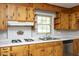 Charming kitchen featuring knotty pine cabinets, and a practical gas cooktop at 1209 Landon St, Durham, NC 27703