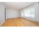 Spacious living room featuring hardwood floors, neutral paint, and lots of natural light at 1209 Landon St, Durham, NC 27703