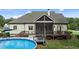 Lovely backyard featuring an above-ground pool, a deck with furniture, and a screened-in porch at 1412 Wakefield Farm Rd, Zebulon, NC 27597