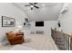 Inviting bonus room with a TV, a cozy leather chair, and an airy, light-filled ambiance at 1412 Wakefield Farm Rd, Zebulon, NC 27597