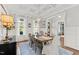 Bright dining room with coffered ceiling, hardwood floors, and large windows at 1412 Wakefield Farm Rd, Zebulon, NC 27597