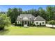Beautiful two-story home with lush lawn and landscaped garden at 1412 Wakefield Farm Rd, Zebulon, NC 27597