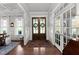 Welcoming foyer with hardwood floors and elegant double doors at 1412 Wakefield Farm Rd, Zebulon, NC 27597