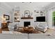 Cozy living room with fireplace, built-in shelves and comfortable seating at 1412 Wakefield Farm Rd, Zebulon, NC 27597