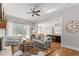 Inviting living room with open layout connecting to kitchen and outdoor patio at 1412 Wakefield Farm Rd, Zebulon, NC 27597