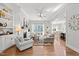 Bright living room featuring fireplace and open floor plan to dining area at 1412 Wakefield Farm Rd, Zebulon, NC 27597