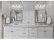 Bathroom boasts double sinks, marble countertops, modern fixtures, and ample storage space at 1412 Wakefield Farm Rd, Zebulon, NC 27597