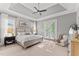 Spacious main bedroom with tray ceiling, large windows, and a private entrance to the backyard at 1412 Wakefield Farm Rd, Zebulon, NC 27597