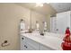 Bright bathroom featuring white cabinets, modern fixtures, a large mirror, and stylish decor at 14393 Nc Hwy 96 N, Zebulon, NC 27597