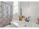 Bright bathroom features a modern sink, stylish fixtures, and a window providing natural light at 14393 Nc Hwy 96 N, Zebulon, NC 27597