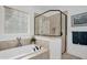 Bright bathroom with a glass enclosed shower, a large soaking tub, and nautical decorations at 14393 Nc Hwy 96 N, Zebulon, NC 27597