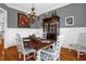 Cozy dining room offers charming chandelier, a hutch, and classic wainscotting detail at 14393 Nc Hwy 96 N, Zebulon, NC 27597