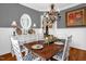 Charming dining room displays a decorative mirror, sideboard, and chandelier lighting at 14393 Nc Hwy 96 N, Zebulon, NC 27597