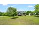 Sprawling lawn and mature trees surround this lovely two-story home with dormer windows at 14393 Nc Hwy 96 N, Zebulon, NC 27597