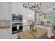 Elegant kitchen features stainless appliances, granite countertops, island and custom cabinets at 14393 Nc Hwy 96 N, Zebulon, NC 27597