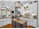 Gourmet kitchen with custom cabinets, stainless steel appliances, granite countertops, and kitchen island at 14393 Nc Hwy 96 N, Zebulon, NC 27597