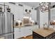 Charming kitchen features white cabinets, stainless appliances, wood floors and granite countertops at 14393 Nc Hwy 96 N, Zebulon, NC 27597