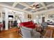 Open-concept living room with hardwood floors, coffered ceiling, and seamless flow throughout at 14393 Nc Hwy 96 N, Zebulon, NC 27597