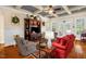 Spacious living room boasts coffered ceilings, hardwood floors, and a cozy seating area at 14393 Nc Hwy 96 N, Zebulon, NC 27597