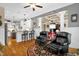 Open-concept living room showcases hardwood floors, columns, and seamless flow to other spaces at 14393 Nc Hwy 96 N, Zebulon, NC 27597