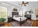 Spacious main bedroom with beautiful hardwood floors, a decorative rug, and lots of natural light at 14393 Nc Hwy 96 N, Zebulon, NC 27597