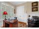 Comfortable home office with plantation shutters, a wood desk, and built in moulding at 14393 Nc Hwy 96 N, Zebulon, NC 27597