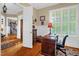 Spacious home office with wainscoting, bright windows, and wood flooring throughout at 14393 Nc Hwy 96 N, Zebulon, NC 27597