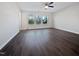 Spacious bedroom with hardwood floors, natural light, a ceiling fan, and a tranquil atmosphere at 1466 Salem Creek Dr, Apex, NC 27502
