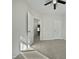A cozy bedroom with carpet, ceiling fan, and a view into the hallway at 1466 Salem Creek Dr, Apex, NC 27502