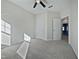 A spacious bedroom with carpeted floors, ceiling fan, and a closet space at 1466 Salem Creek Dr, Apex, NC 27502