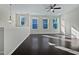 Bright loft space with hardwood floors, a ceiling fan, large windows, and a versatile layout at 1466 Salem Creek Dr, Apex, NC 27502