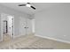 Spacious bedroom featuring plush carpeting, multiple entryways, and neutral walls at 154 Buckaroo Dr, Louisburg, NC 27549
