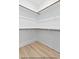 Walk-in closet with wood shelving and ample storage, perfect for organization at 154 Buckaroo Dr, Louisburg, NC 27549