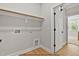 Neutral laundry room with modern hookups, leading into another room at 154 Buckaroo Dr, Louisburg, NC 27549
