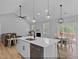 Open-concept living space with kitchen island, dining area, fireplace, and a comfortable couch at 154 Buckaroo Dr, Louisburg, NC 27549
