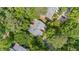 Aerial view of the property showcasing its unique architecture and wooded surroundings at 16 Tottenham Ln # 16, Chapel Hill, NC 27517