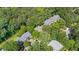 An aerial view of the neighborhood showcasing lush green trees and beautiful homes at 16 Tottenham Ln # 16, Chapel Hill, NC 27517