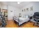 Bedroom featuring hardwood floors, ceiling fan, and a modern bed frame at 16 Tottenham Ln # 16, Chapel Hill, NC 27517